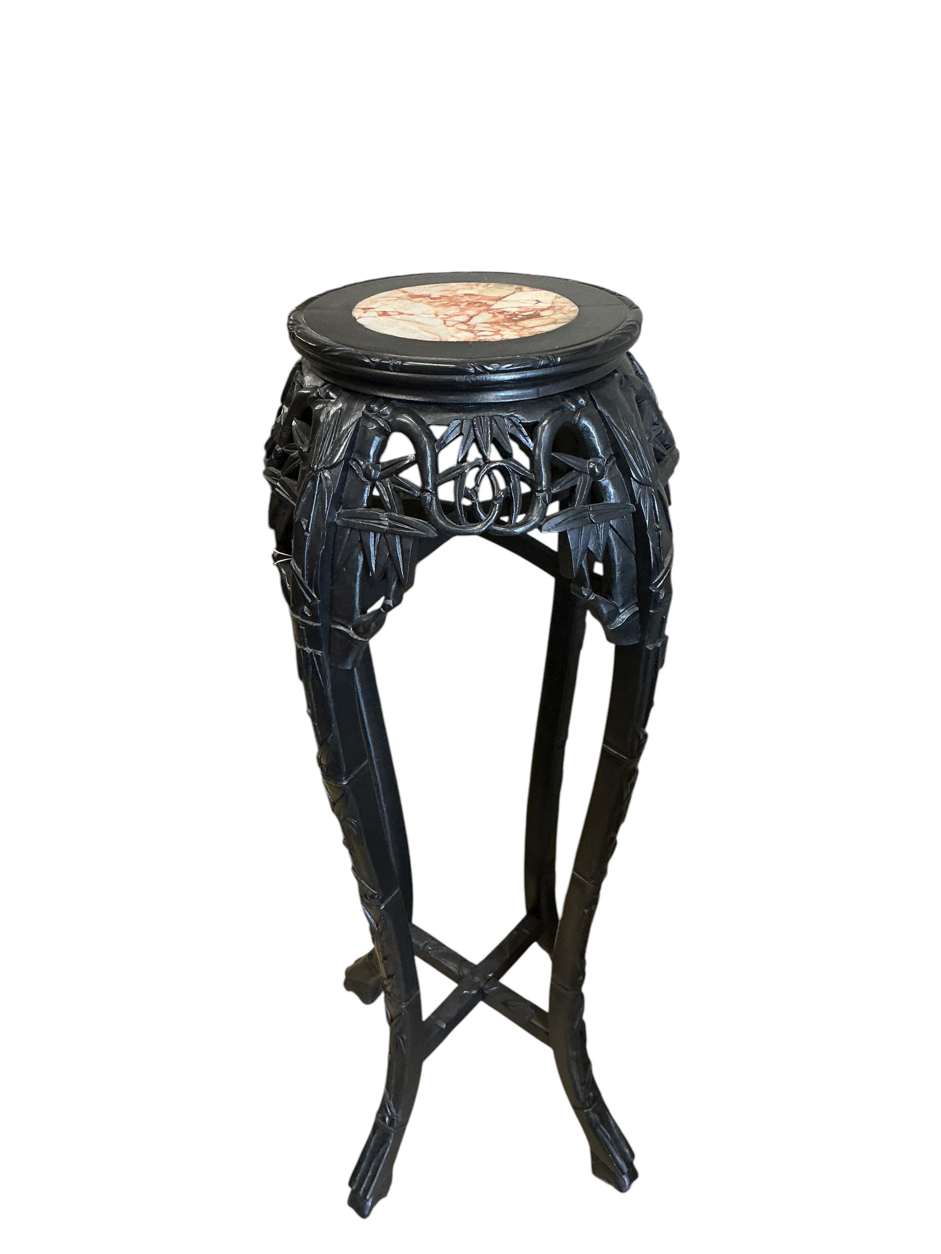 A Chinese marble topped vase stand, diameter 34cm, height 90cm